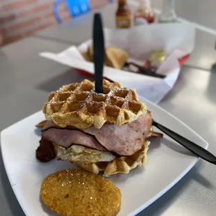 a ham and waffle sandwich on a plate