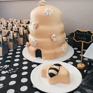 Baby shower beehive cake with gender reveal bee