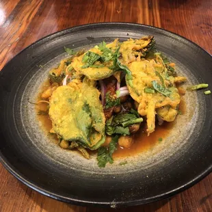 Fried spinach on top with three layers underneath