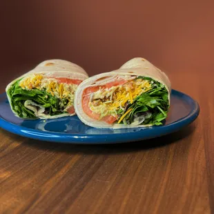 wo burritos on a blue plate