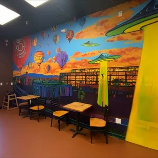  brightly colored mural in a restaurant