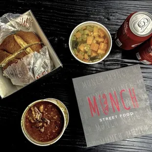 a sandwich, soup, and soda