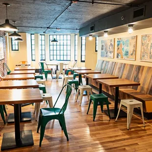 a dining area with tables and chairs