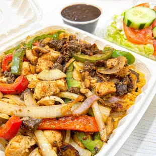 Steak and Chicken Fajita, served with Vegetable Rice, Tortilla and choice of Salad or Black Beans.