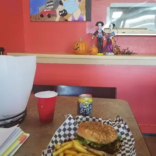 Munchies Burger with fries and a can of Brisk.