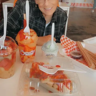 Churros, fresh fruit boat, mangonada, fruit cup with chamoy, mint bluebell ice cream!