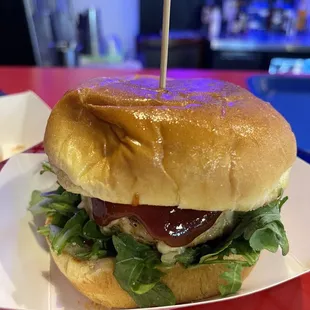 a sandwich with lettuce and ketchup