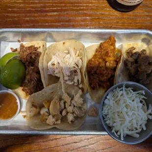 One of each of the meats offered for Taco Tuesday (no pico or cilantro).