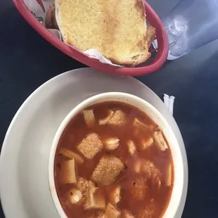 a bowl of soup and a sandwich