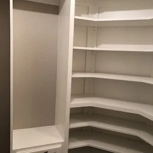 After. Lots of adjustable shoe shelves and short dress hanging area over built in hamper.