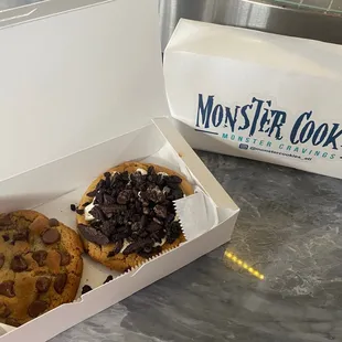 two chocolate chip cookies in a box