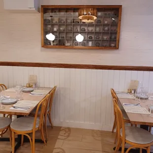 a dining room with tables and chairs