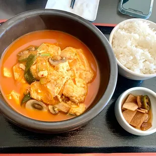 Spicy Soft Tofu Stew with mushroom  comes with rice &amp; pickles . More soup than stew. Mild but tasty.   $12     4*