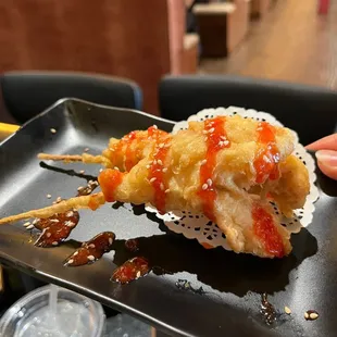 a hand holding a piece of food