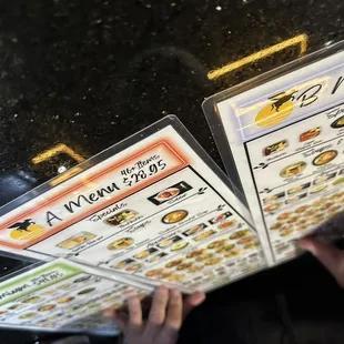 a person holding a menu