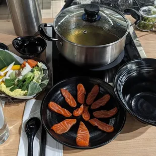 4oz salmon with veggie broth, veggies, udon, and white rice $23, a bit steep for a small portion during soft opening