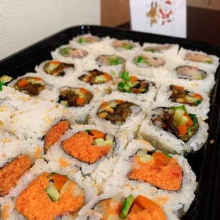 a tray of sushi on a table