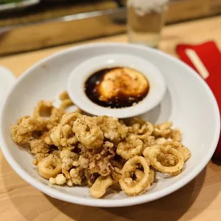 a plate of calamails and sauce