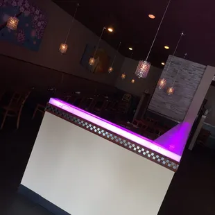 a white counter with purple lights