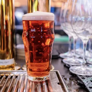 a beer being poured into a glass