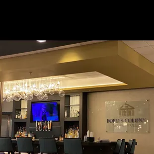 a bar with a television in the background