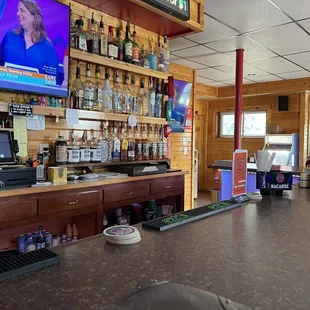 a bar with a television in the background