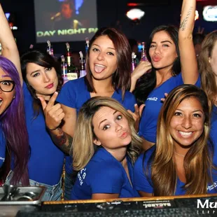 a group of women at a bar