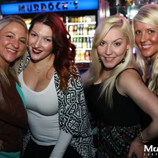 a group of women at a bar