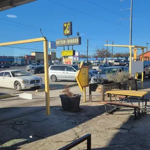 Outdoors sign and line for drive-thru.