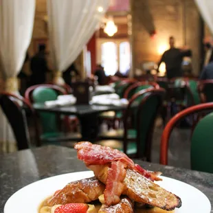 Bananas Foster Pain Perdu:  Gendusa bakery French bread, apple wood smoked bacon, fresh berries, bana-rum sauce