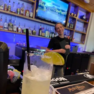 a woman behind a bar counter