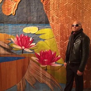 Jay in front of Philip Campbell's carved mahogany installation at GC Murphy building