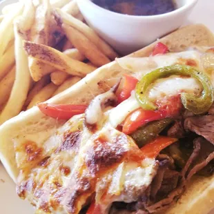 Prime dip, shaved prime rib on a fresh roll with sauteed bell peppers, onions and melted provolone with side au jus.