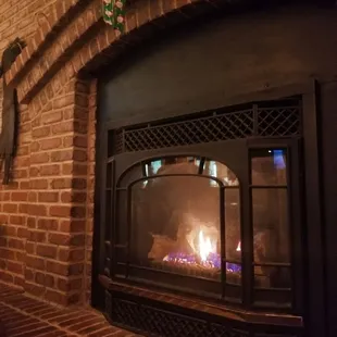 Love the cozy chairs and fire place.