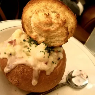 New England clam chowder in a bread bowl with lots of potatoes, yum!