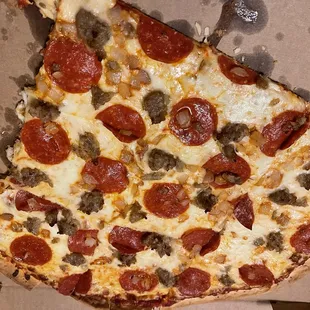 Sausage onion pepperoni pizza