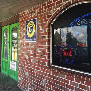 a neon sign in the window