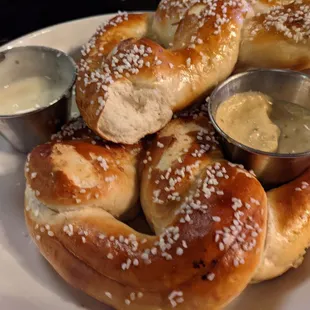 Bavarian pretzel appetizer with cheese sauce and mustard. Hot fresh in just the right amount of salt