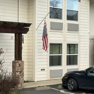 Flag barely holding on like this dump