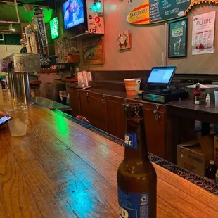 a bottle of beer on the bar