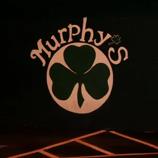 the logo of a four leaf clover