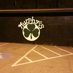 a parking lot with a car parked in it