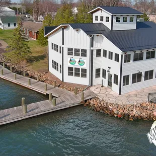 an aerial view of a house and dock