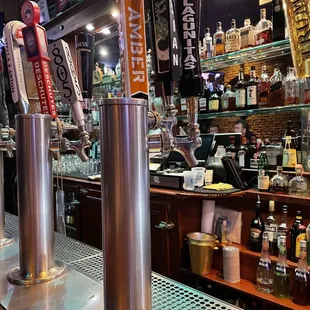 a row of beer taps