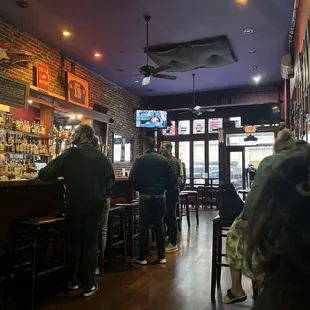 people sitting at the bar