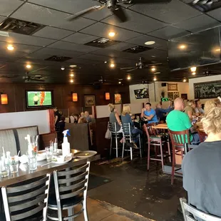 a large group of people sitting at tables