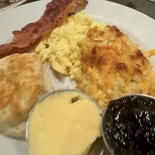 The Best! Biscuits &amp; Gravy, Butter, Grape Jelly, Crispy Bacon, Fluffy Eggs, Casserole with creamy cheesy potatoes (crushed bacon on top)!