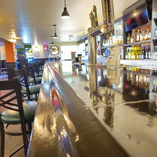 a bar with a row of bar stools