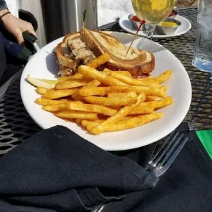 a plate of french fries and a sandwich