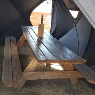 Picnic table in the oversized Covid pod.